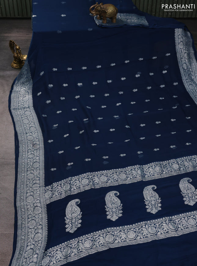 Banarasi chiffon saree peacock green with allover silver zari woven buttas and silver zari woven floral border