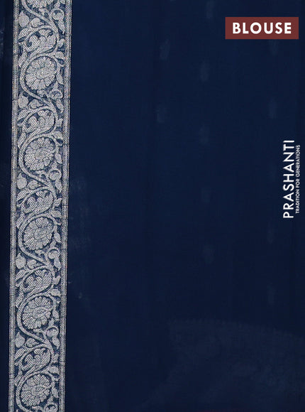 Banarasi chiffon saree peacock green with allover silver zari woven buttas and silver zari woven floral border