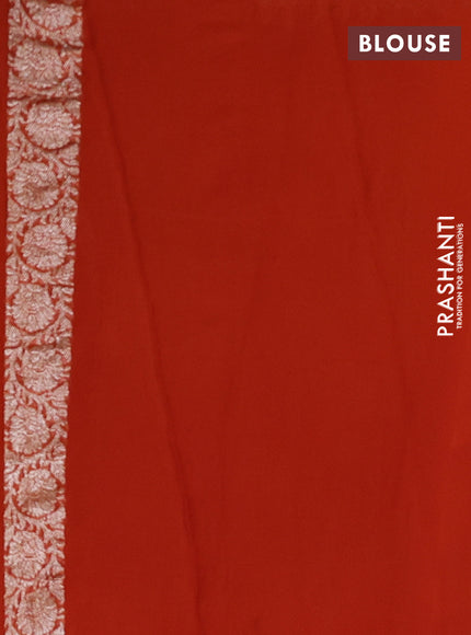 Banarasi chiffon saree rustic orange with allover silver zari woven buttas and silver zari woven floral border