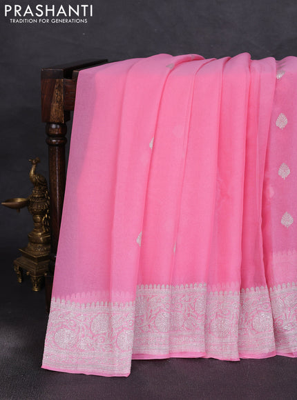 Banarasi chiffon saree peach pink with allover silver zari woven buttas and silver zari woven floral border