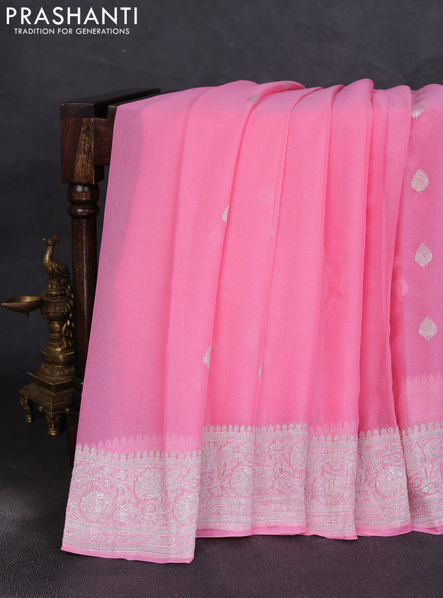 Banarasi chiffon saree peach pink with allover silver zari woven buttas and silver zari woven floral border