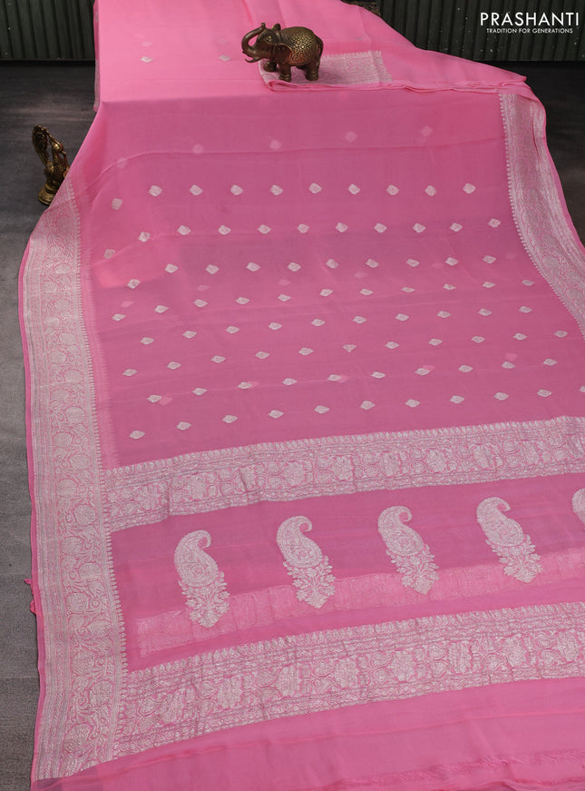 Banarasi chiffon saree peach pink with allover silver zari woven buttas and silver zari woven floral border