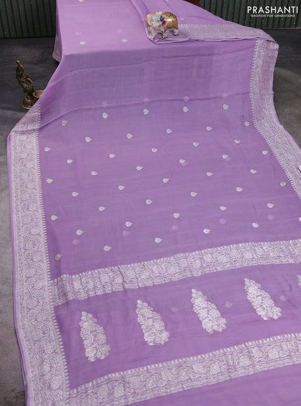 Banarasi chiffon saree lavender with allover silver zari woven buttas and silver zari woven floral border
