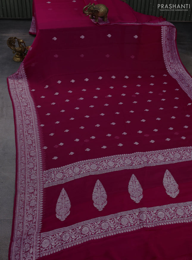 Banarasi chiffon saree dark pink with allover silver zari woven buttas and silver zari woven floral border