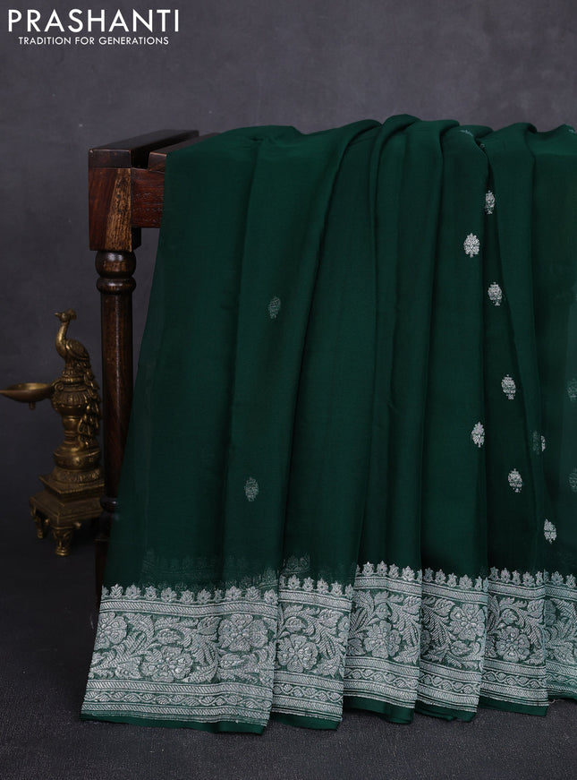 Banarasi chiffon saree bottle green with allover silver zari woven buttas and silver zari woven floral border