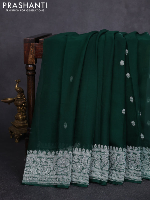 Banarasi chiffon saree bottle green with allover silver zari woven buttas and silver zari woven floral border
