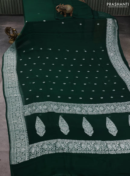 Banarasi chiffon saree bottle green with allover silver zari woven buttas and silver zari woven floral border