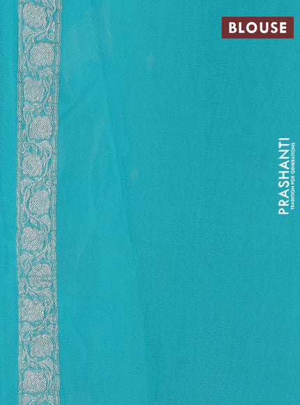 Banarasi chiffon saree teal blue with allover silver zari woven buttas and silver zari woven floral border