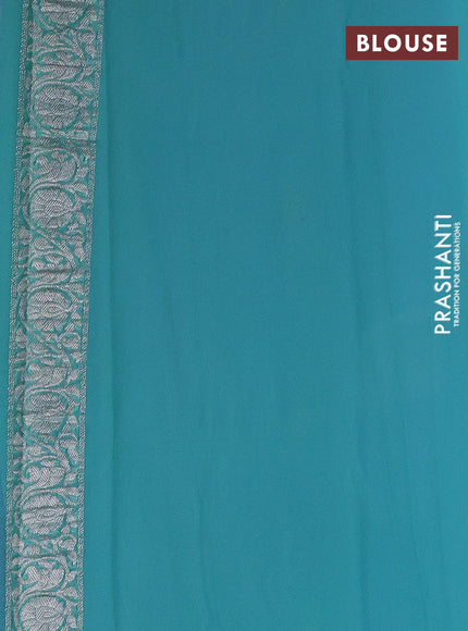 Banarasi chiffon saree teal blue and teal green with allover silver zari woven paisley buttas and silver zari woven floral border