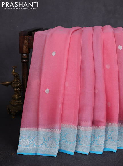 Banarasi chiffon saree peach pink and teal blue with allover silver zari woven buttas and silver zari woven floral border