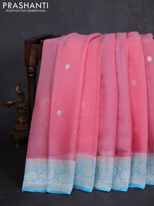 Banarasi chiffon saree peach pink and teal blue with allover silver zari woven buttas and silver zari woven floral border