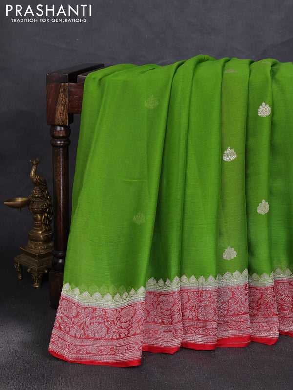 Banarasi chiffon saree green shade and red with allover silver zari woven buttas and silver zari woven floral border