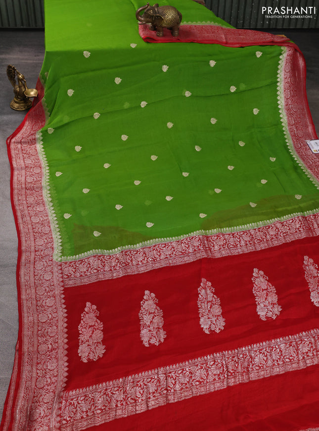 Banarasi chiffon saree green shade and red with allover silver zari woven buttas and silver zari woven floral border