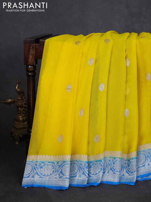 Banarasi chiffon saree yellow and cs blue with allover silver zari woven buttas and silver zari woven floral border