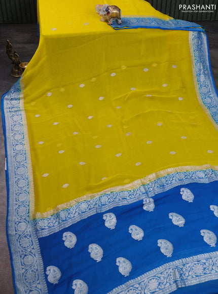 Banarasi chiffon saree yellow and cs blue with allover silver zari woven buttas and silver zari woven floral border