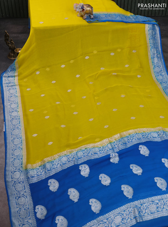 Banarasi chiffon saree yellow and cs blue with allover silver zari woven buttas and silver zari woven floral border