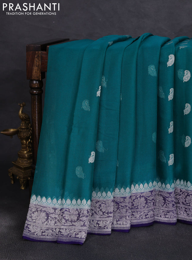 Banarasi chiffon saree peacock green and navy blue with allover silver zari woven buttas and silver zari woven floral border