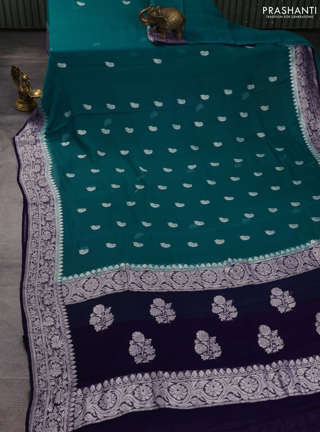 Banarasi chiffon saree peacock green and navy blue with allover silver zari woven buttas and silver zari woven floral border