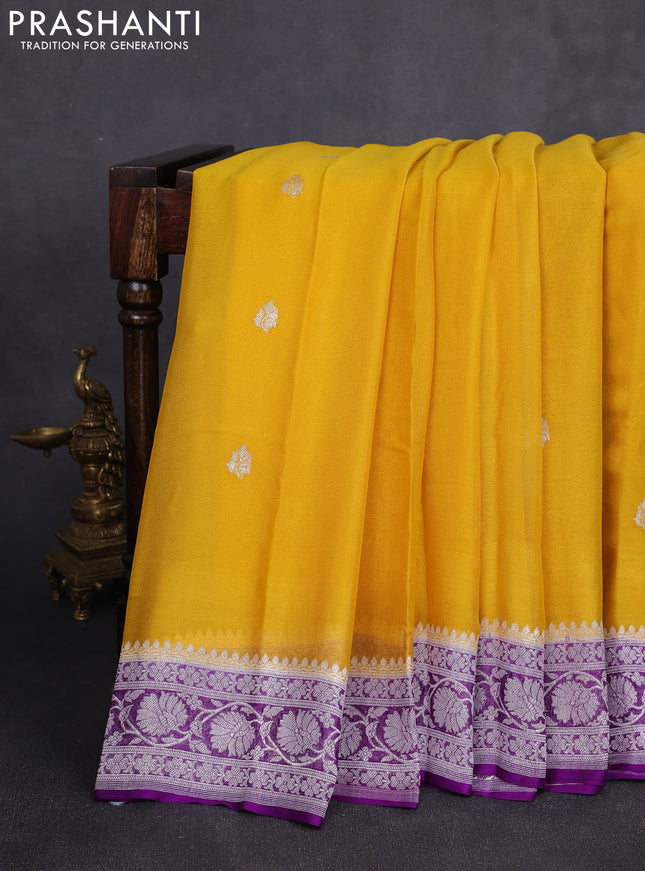 Banarasi chiffon saree yellow and purple with allover silver zari woven buttas and silver zari woven floral border