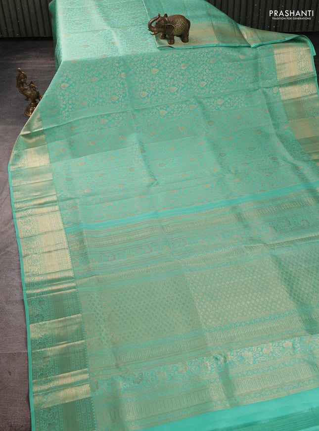 Pure kanchipuram silk saree teal green with allover zari woven brocade weaves and long rich zari woven border