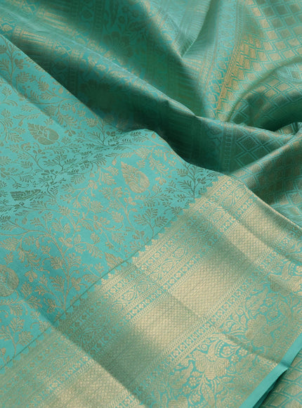 Pure kanchipuram silk saree teal green with allover zari woven brocade weaves and long rich zari woven border