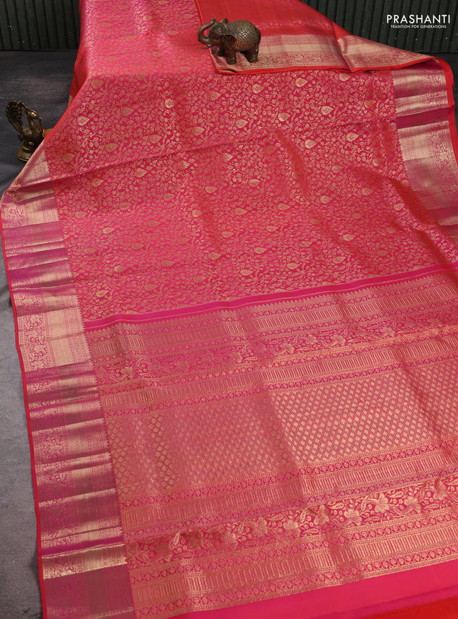 Pure kanchipuram silk saree dual shade of pinkish orange with allover zari woven brocade weaves and rich zari woven border
