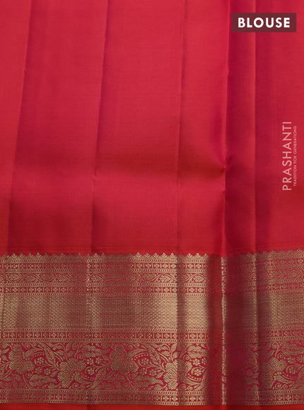 Pure kanchipuram silk saree dual shade of pinkish orange with allover zari woven brocade weaves and rich zari woven border