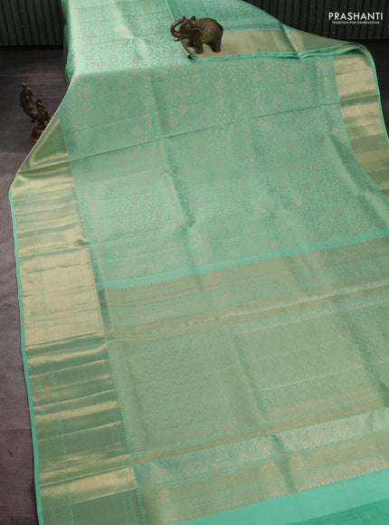 Pure kanchipuram silk saree teal green with allover brocade weaves and long rich zari woven border