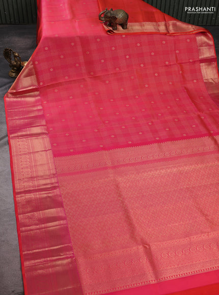 Pure kanchipuram silk saree dual shade of pinkish orange with allover zari small checks & buttas and rich zari woven border