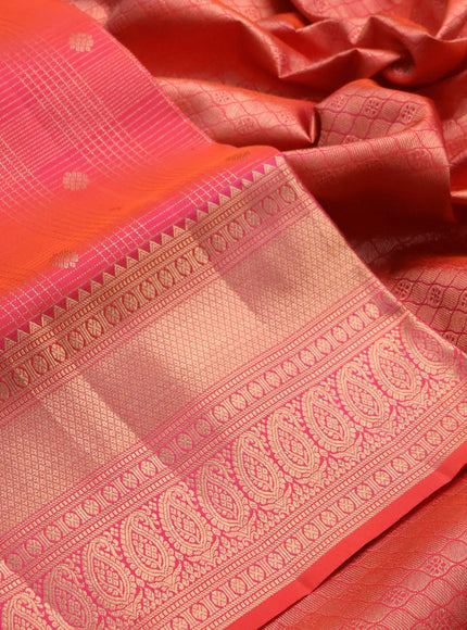 Pure kanchipuram silk saree dual shade of pinkish orange with allover zari small checks & buttas and rich zari woven border