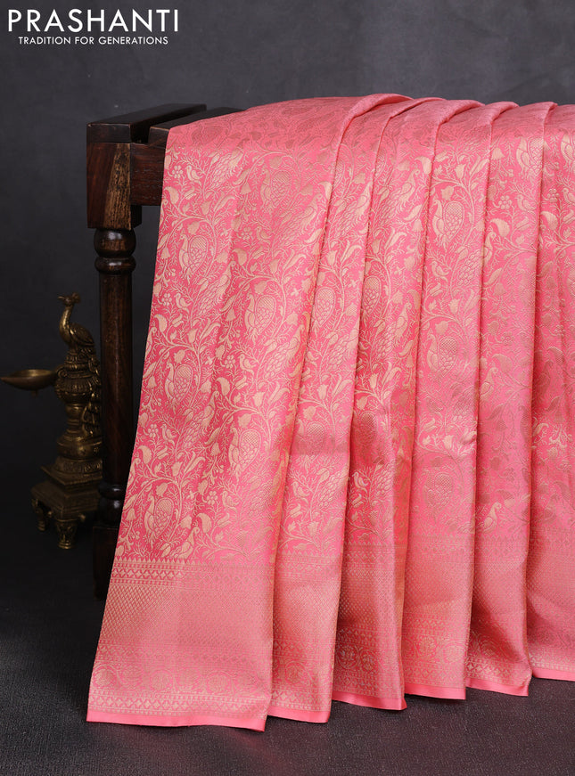 Pure kanchipuram silk saree peach shade with allover zari woven brocade weaves and zari woven border