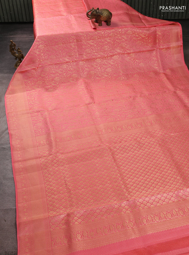 Pure kanchipuram silk saree peach shade with allover zari woven brocade weaves and zari woven border