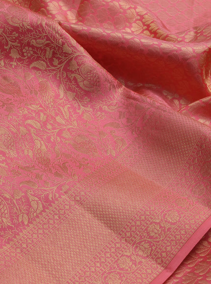 Pure kanchipuram silk saree peach shade with allover zari woven brocade weaves and zari woven border