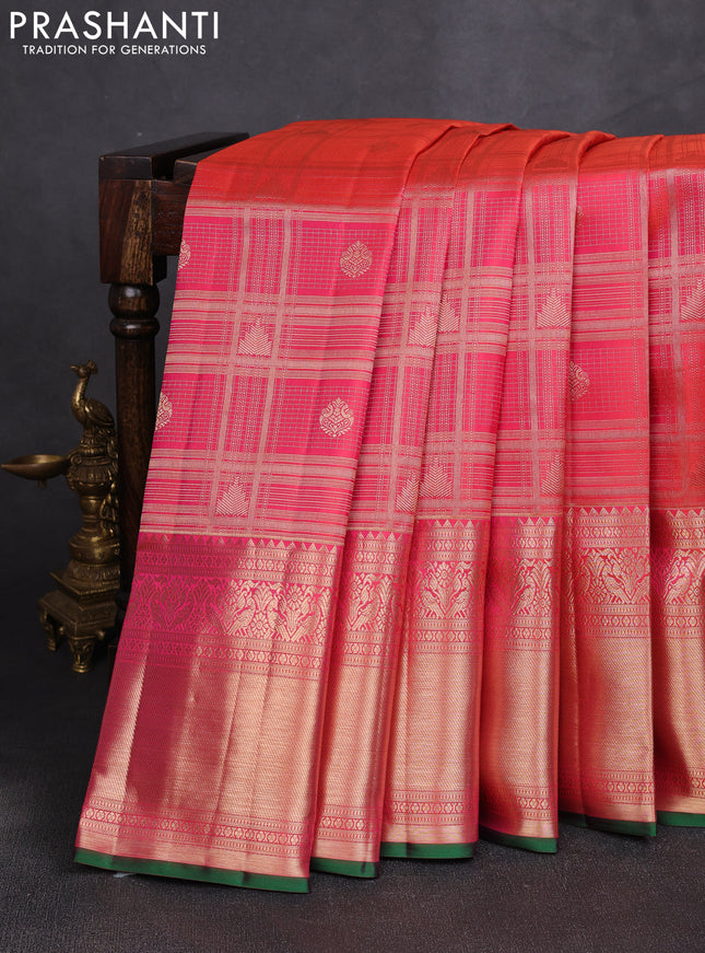Pure kanchipuram silk saree dual shade of pinkish orange with allover zari checks & buttas and long rich zari woven border
