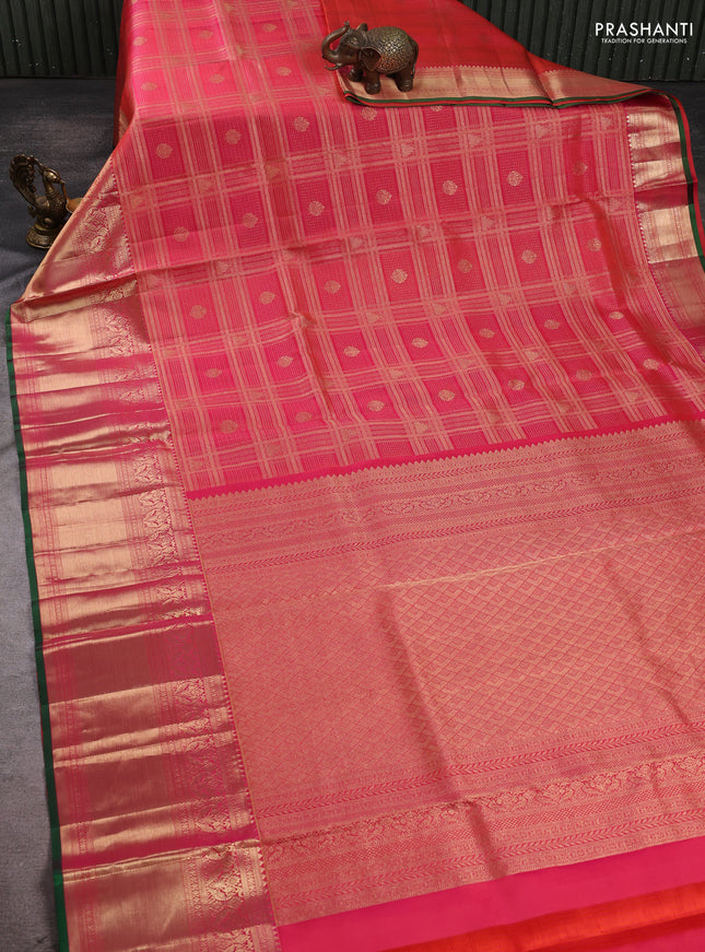 Pure kanchipuram silk saree dual shade of pinkish orange with allover zari checks & buttas and long rich zari woven border