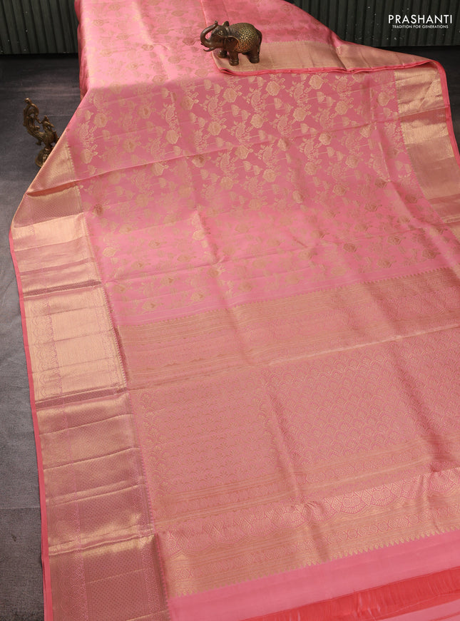 Pure kanchipuram silk saree peach shade with allover zari woven brocade weaves and zari woven border