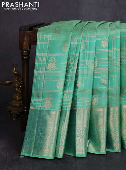 Pure kanchipuram silk saree teal shade with allover zari checks & buttas and long zari woven border