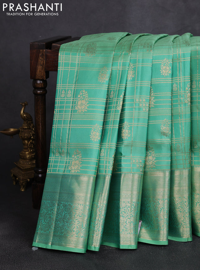Pure kanchipuram silk saree teal shade with allover zari checks & buttas and long zari woven border
