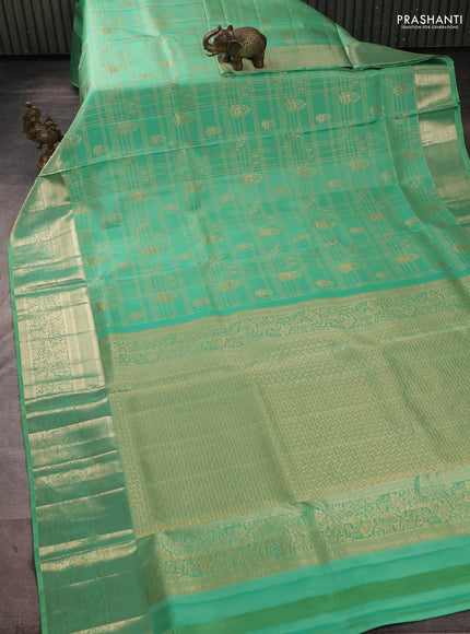 Pure kanchipuram silk saree teal shade with allover zari checks & buttas and long zari woven border