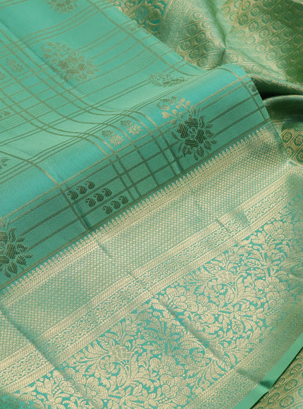 Pure kanchipuram silk saree teal shade with allover zari checks & buttas and long zari woven border