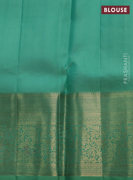 Pure kanchipuram silk saree teal shade with allover zari checks & buttas and long zari woven border