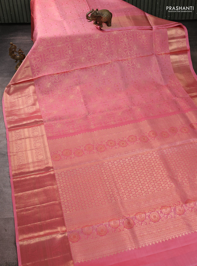 Pure kanchipuram silk saree peach pink with allover zari woven brocade weaves and long zari woven border