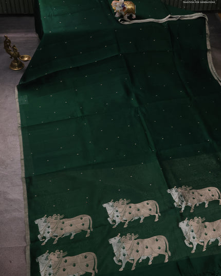 Pure Organza silk saree bottle green with zari woven buttas and zari woven piping border