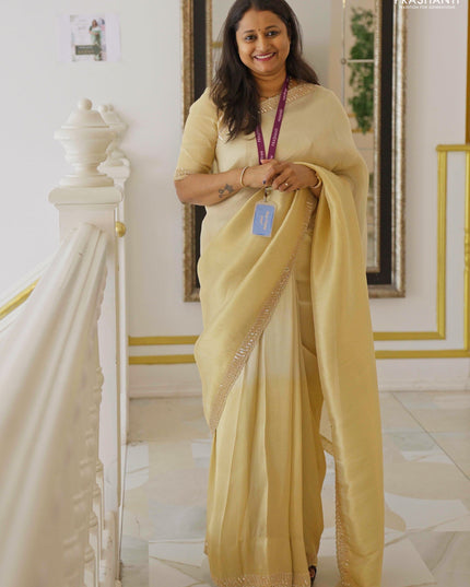 Tissue silk saree cream with plain body and embroidery border