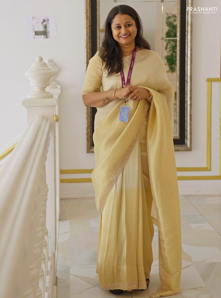 Tissue silk saree cream with plain body and embroidery border