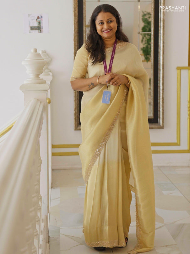 Tissue silk saree cream with plain body and embroidery border