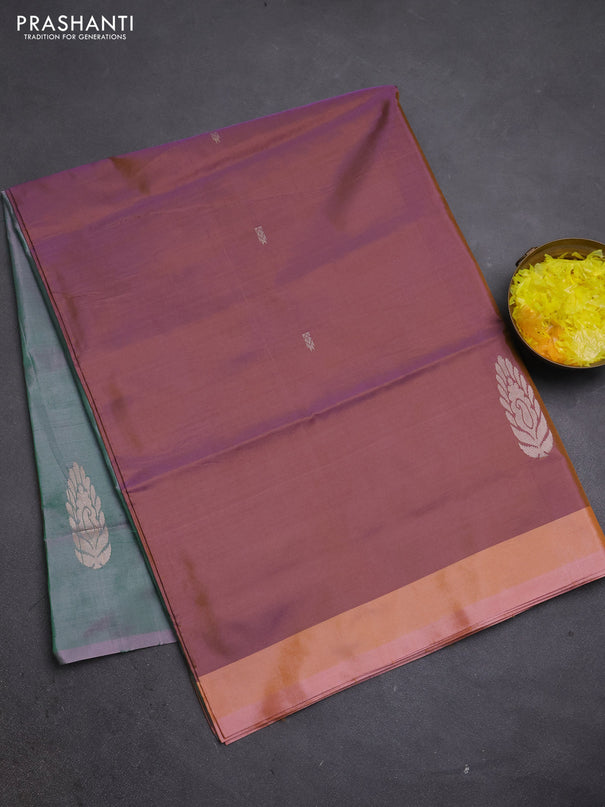 Banana pith saree dual shade of peach shade and green with thread woven buttas and simple border