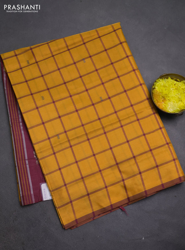 Banana pith saree mustard yellow and maroon with allover checks & thread woven buttas and piping border