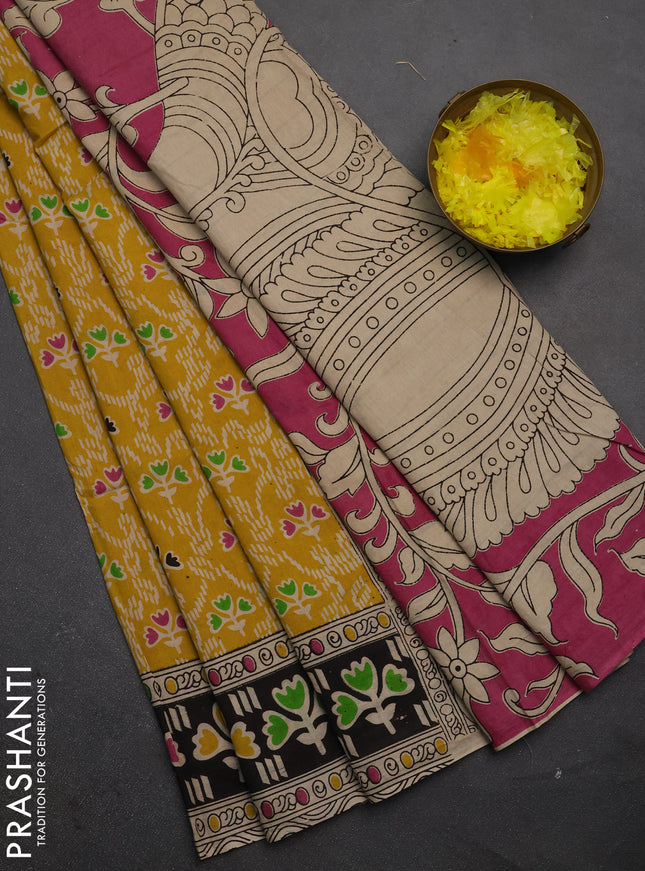 Kalamkari cotton saree yellow and black with allover prints and printed border
