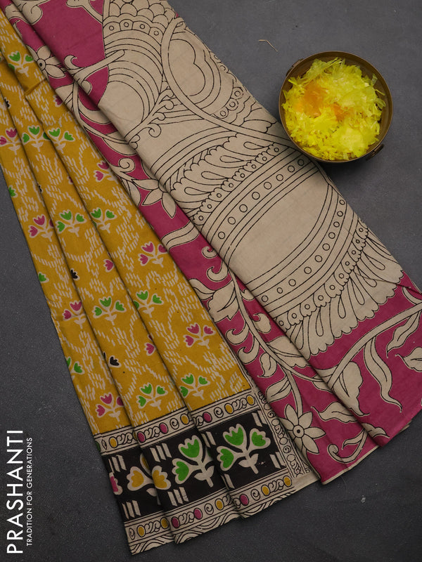 Kalamkari cotton saree yellow and black with allover prints and printed border
